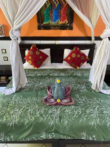 Postel nebo postele na pokoji v ubytování Putu Guest House Pemuteran