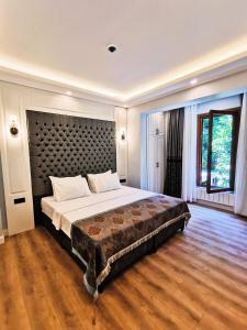 Postel nebo postele na pokoji v ubytování Luxx Garden Hotel
