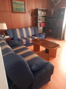 a living room with two couches and a coffee table at Largo in Crikvenica +15 photos
