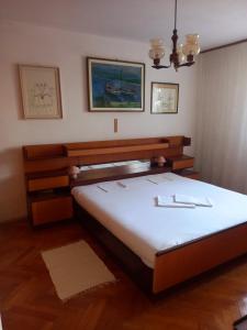 a bedroom with a large bed in a room at Largo in Crikvenica