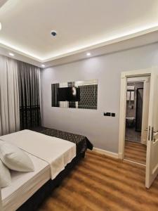 Postel nebo postele na pokoji v ubytování Luxx Garden Hotel