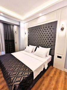 Postel nebo postele na pokoji v ubytování Luxx Garden Hotel