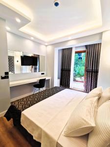 Postel nebo postele na pokoji v ubytování Luxx Garden Hotel + 37 fotografií