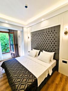 Postel nebo postele na pokoji v ubytování Luxx Garden Hotel