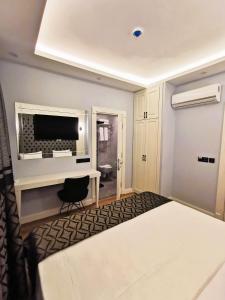 Postel nebo postele na pokoji v ubytování Luxx Garden Hotel