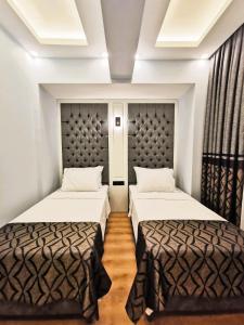 Postel nebo postele na pokoji v ubytování Luxx Garden Hotel