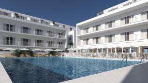 a swimming pool in front of a building at SH Jávea in Jávea