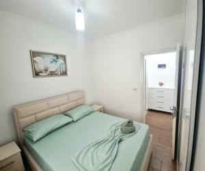 Ένα ή περισσότερα κρεβάτια σε δωμάτιο στο Teli's Apartments