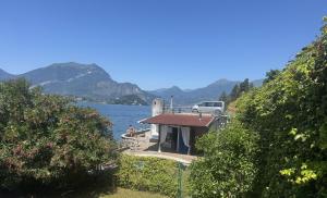 a small house on the shore of a lake at Villa Planca by Gottschalk in Fiumelatte