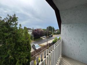 a view of a street from a balcony at Sóstó Suites in Igricetanya