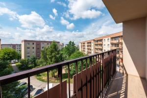 a balcony with a view of buildings at ApartGo! P in Radom