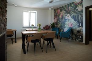 a dining room with a table and some chairs at Penzion 666 Slavonice in Slavonice