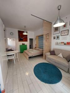 a living room with a couch and a table at Izola old city centre with parking in Izola