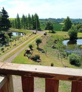 a view of a farm with animals in a field at gîte des 1000 étangs in Saint-Bresson
