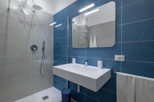 a bathroom with a white sink and a mirror at Jolanda Sea Breeze in Trapani +75 photos