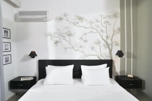 Cama ou camas em um quarto em Hotel Kalloni