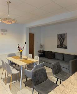 a living room with a table and chairs and a couch at Stou Stefani in Agros +19 photos