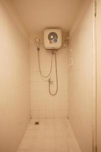 a bathroom with a shower with a shower head at SkyBreeze Sentraland in Medan +47 photos