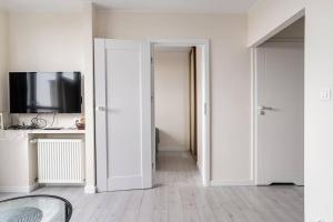 Televízia a/alebo spoločenská miestnosť v ubytovaní Przechodnia2-ac-park View-2 Rooms