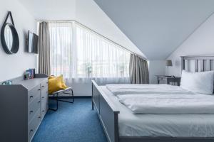 Ένα ή περισσότερα κρεβάτια σε δωμάτιο στο Haus Seeblick Wohnung 21 Forever21