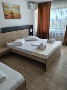 Postel nebo postele na pokoji v ubytování Hotel Gloria