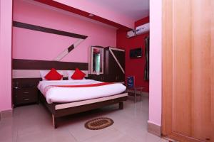 Ένα ή περισσότερα κρεβάτια σε δωμάτιο στο Hotel O Guddu Residency
