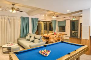 a living room with a pool table at Sea Sand Garden Villa in Phan Thiet