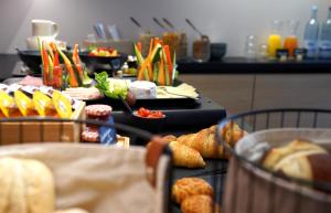 a table with a buffet of food on it at Hotel Marktliege in Erolzheim