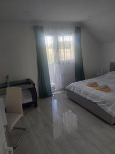 Postel nebo postele na pokoji v ubytování Apartman Pavenka