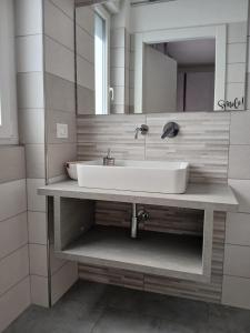 a bathroom with a sink and a mirror at LaVenere da Gigi e Patty in San Salvo +39 photos