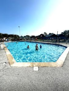a group of people in a swimming pool at Miarlo Lodge Rydal Haven Lakeland in Flookburgh
