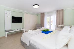 A bed or beds in a room at Villa Baycasa