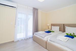 A bed or beds in a room at Villa Baycasa