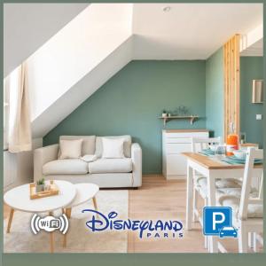 a living room with a white couch and a table at Le Délicat - Cozy - Disney 5min - Free Parking in Magny-le-Hongre