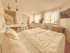 Posteľ alebo postele v izbe v ubytovaní Trio Apartments