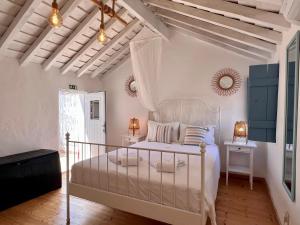 Ένα ή περισσότερα κρεβάτια σε δωμάτιο στο Casa do Pescador By ALGARTUR