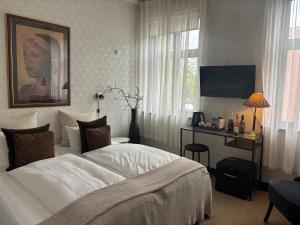 Voodi või voodid majutusasutuse Park Hotel & Vinbar toas
