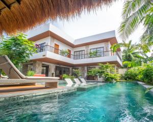 an exterior view of a villa with a swimming pool at Villa Sima - Tropical Elegance in central Panglao in Panglao