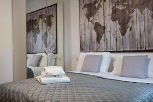 a bedroom with two beds with a map on the wall at Alba apartments in Biassa