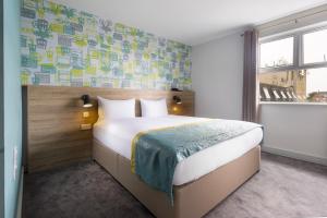 Ένα ή περισσότερα κρεβάτια σε δωμάτιο στο The Camden Street Hotel