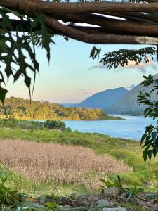 a view of a lake with mountains in the background at Slash homestay in Silimapuluh