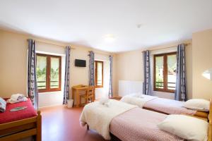 Postel nebo postele na pokoji v ubytování Auberge du Freney