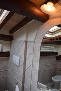 a bathroom with a mirror and a sink and a toilet at Mazzini 16 in Perugia +27 photos
