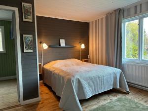 Postel nebo postele na pokoji v ubytování Aspa Herrgård - Handelshuset