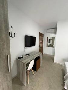 TV a/nebo společenská místnost v ubytování Hostal Malia