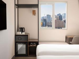 ibis Ambassador Seoul Insadong-Newly renovated in 2025にあるベッド
