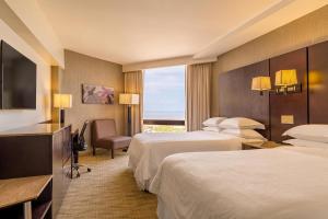 Postel nebo postele na pokoji v ubytování Sheraton Grand Panama