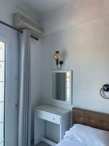 A bed or beds in a room at Agnàntema Portside Stays Skiathos