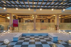 a large lobby with a stage in the center at The Stay Villa in Srinagar