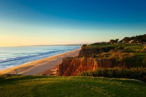 a view of a beach and the ocean at Vale Do Lobo Resort in Vale do Lobo